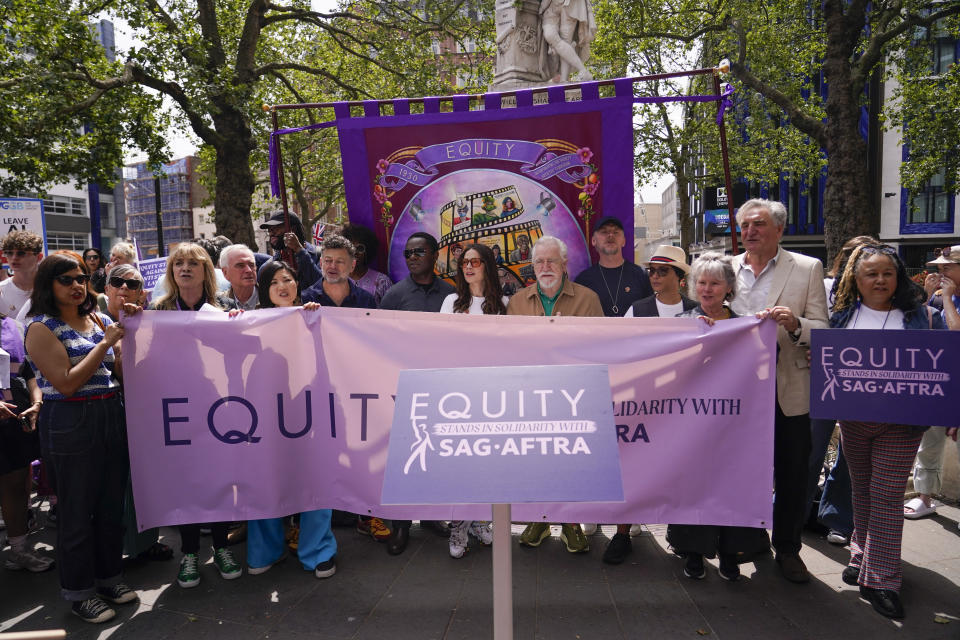 Actors participate in a rally by the UK actors union Equity, in support of the SAG-AFTRA strike on Friday, July 21, 2023, in London. The actors strike comes more than two months after screenwriters began striking in their bid to get better pay and working conditions. (Alberto Pezzali/Invision/AP)