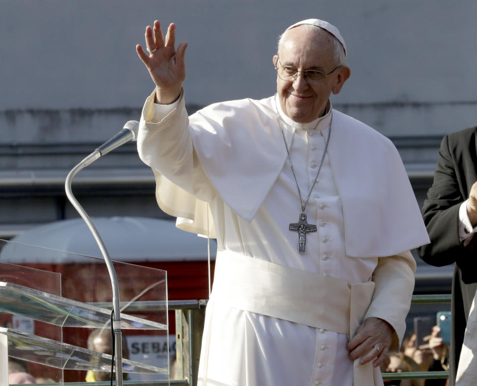 Pope Francis arrives in Milan's Forlanini neighborhood known as Case Bianche (white houses), as part of his one-day pastoral visit to Monza and Milan, Italy’s second-largest city, Saturday, March 25, 2017. The pope's first stop Saturday is a housing project on the outskirts of Italy's fashion and finance capital, a stop that underlines the pope's view that the peripheries offer a better view of reality than well-tended and prosperous city centers. (AP Photo/Antonio Calanni)