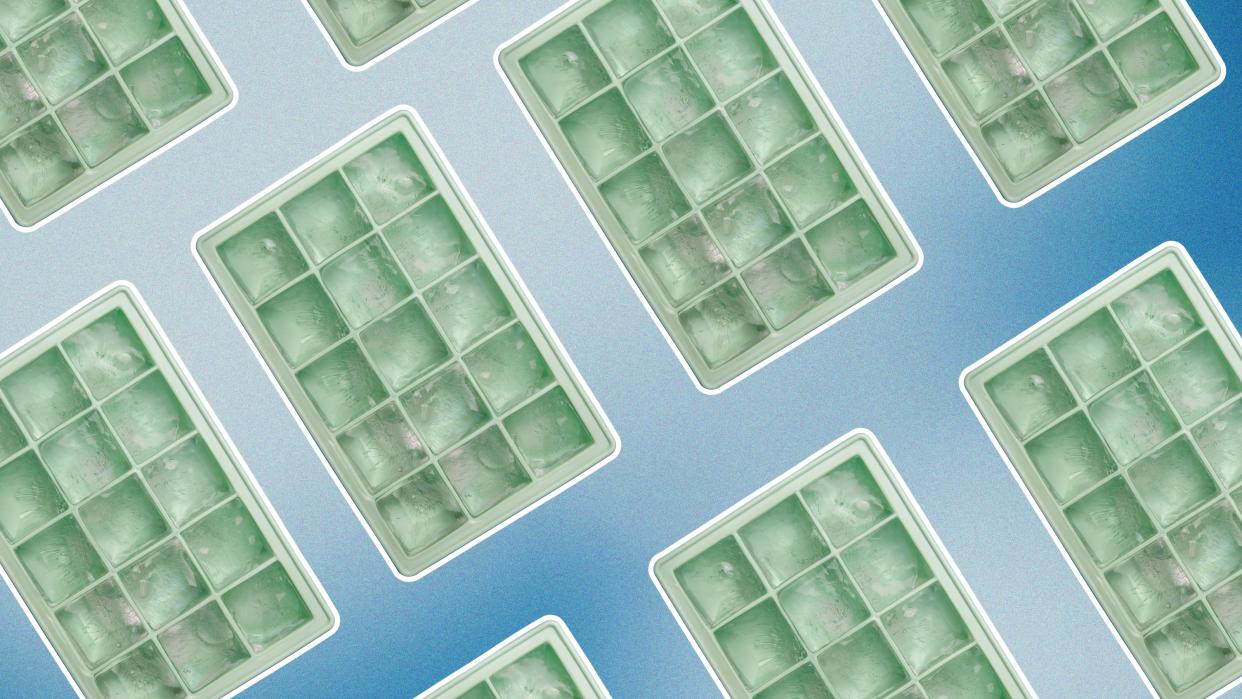  Green ice cube trays on blue background. 