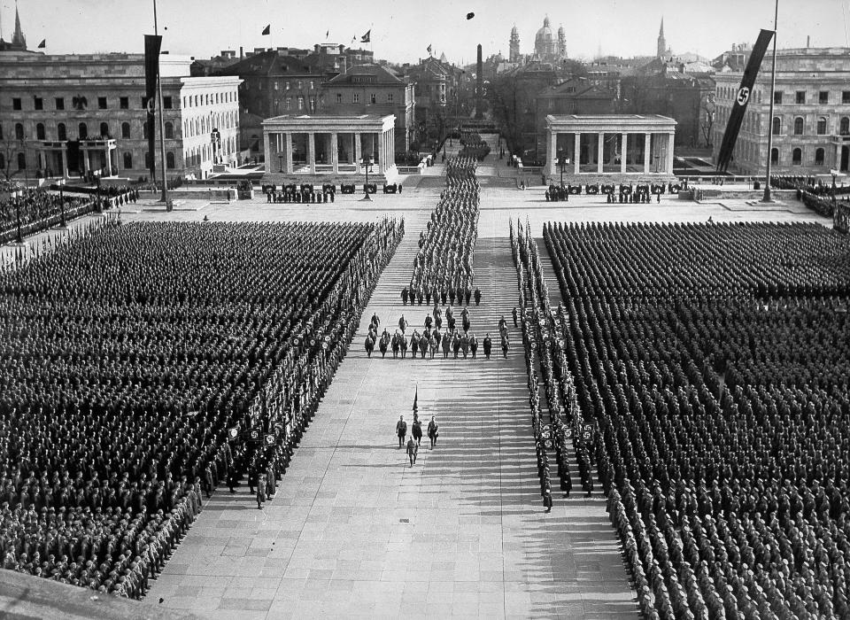 This 1936 photo released by the Bavarian State Library shows a Nazi rally on the Koenigsplatz in Munich, Germany. A failed artist in his native Austria, Hitler drifted to Munich in 1913. When World War I broke out in August 1914, Hitler joined a Bavarian regiment of the German army. He resurfaced in Munich in 1919 and joined the anti-Semitic German Workers' Party, which later became the National Socialist German Workers Party, the Nazis. (AP Photo/Bavarian State Library)