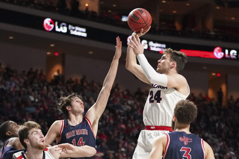 Gonzaga Bulldogs forward Corey Kispert (24) shoots the basketball against Saint Mary's Gaels forward Kyle Bowen (14) during a game on March 10. (Kyle Terada-USA TODAY Sports)