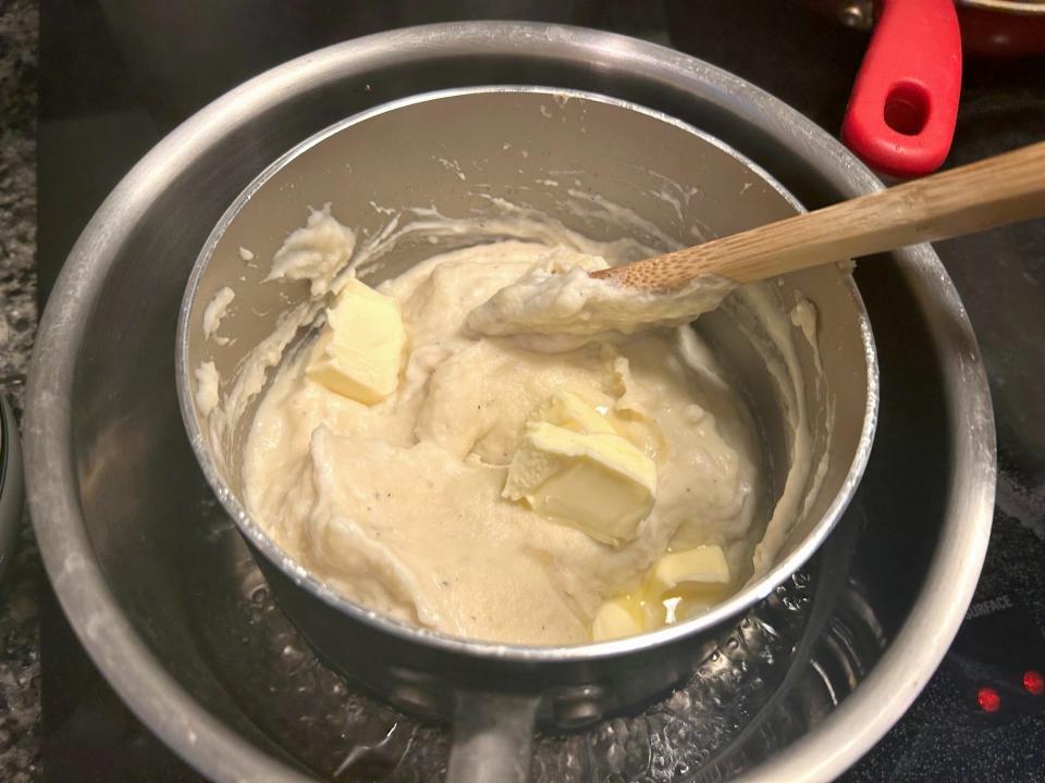 Adding butter to Ina Garten's Parmesan Mashed Potatoes