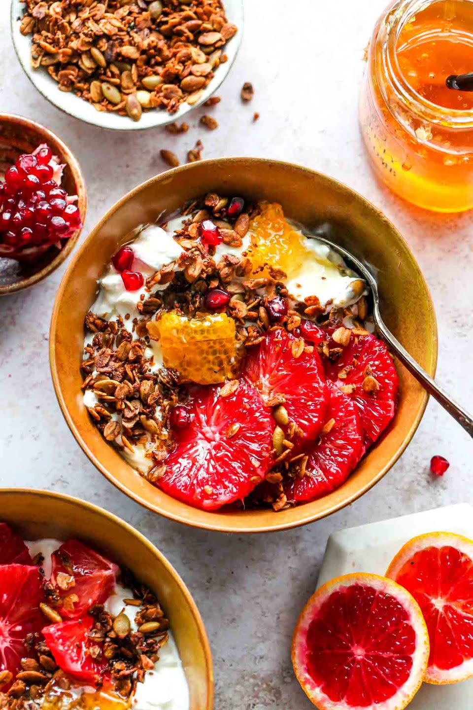 breakfast in bed yogurt protein granola bowl with citrus fruit