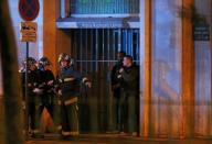 French fire brigade members secure the area near the Bataclan concert hall following fatal shootings in Paris, France, November 13, 2015. REUTERS/Christian Hartmann