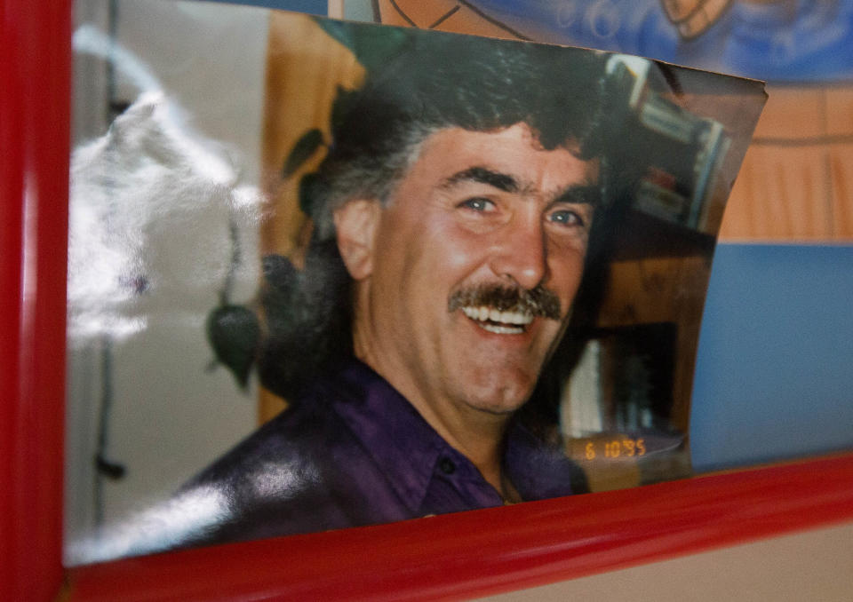 A 1995 photo of Steven Leask on display at the Las Cruces home he shared with his wife. Since his death in 2016, his widow, Libby Leask, has been unable to access his pension.