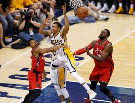 Apr 29, 2016; Indianapolis, IN, USA; Indiana Pacers guard George Hill (3) is fouled by Toronto Raptors guard Kyle Lowry (7) during the first quarter in game six of the first round of the 2016 NBA Playoffs at Bankers Life Fieldhouse. Mandatory Credit: Brian Spurlock-USA TODAY Sports