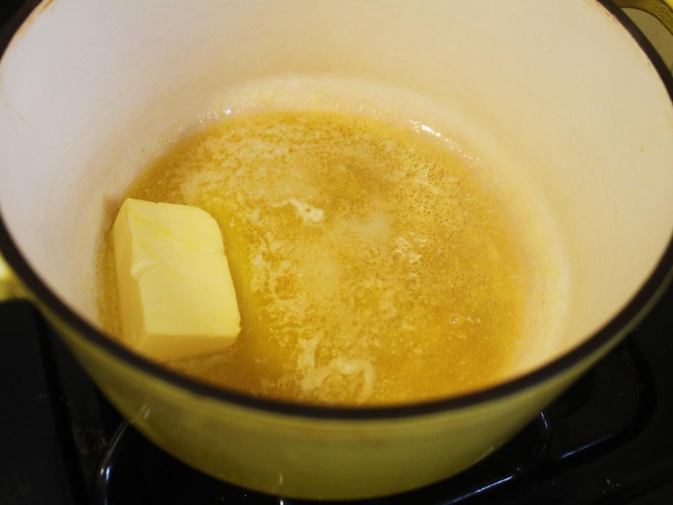 butter melting in a pot on the stove