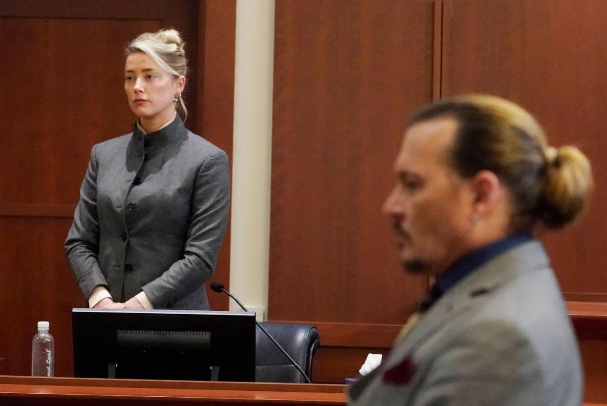 <span class="caption">Amber Heard and Johnny Depp appear in a Virginia courtroom on May 16, 2022 during their trial. </span> <span class="attribution"><a class="link " href="https://media.gettyimages.com/photos/actors-amber-heard-and-johnny-depp-watch-as-the-jury-leaves-the-at-picture-id1240715203?s=2048x2048" rel="nofollow noopener" target="_blank" data-ylk="slk:Steve Helver/Pool/AFP via Getty Images;elm:context_link;itc:0;sec:content-canvas">Steve Helver/Pool/AFP via Getty Images</a></span>