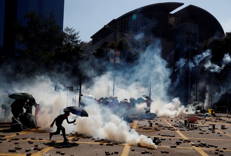 FILE PHOTO: Protesters clash with police outside Hong Kong Polytechnic University (PolyU) in Hong Kong