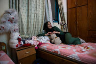 <p>Doaa in a friend’s bedroom. Girls that are unmarried have few places to be themselves. Bedrooms and private cars are sanctuaries where girls can sing and dance without being judged by the public or their own families. (Photograph by Monique Jaques) </p>