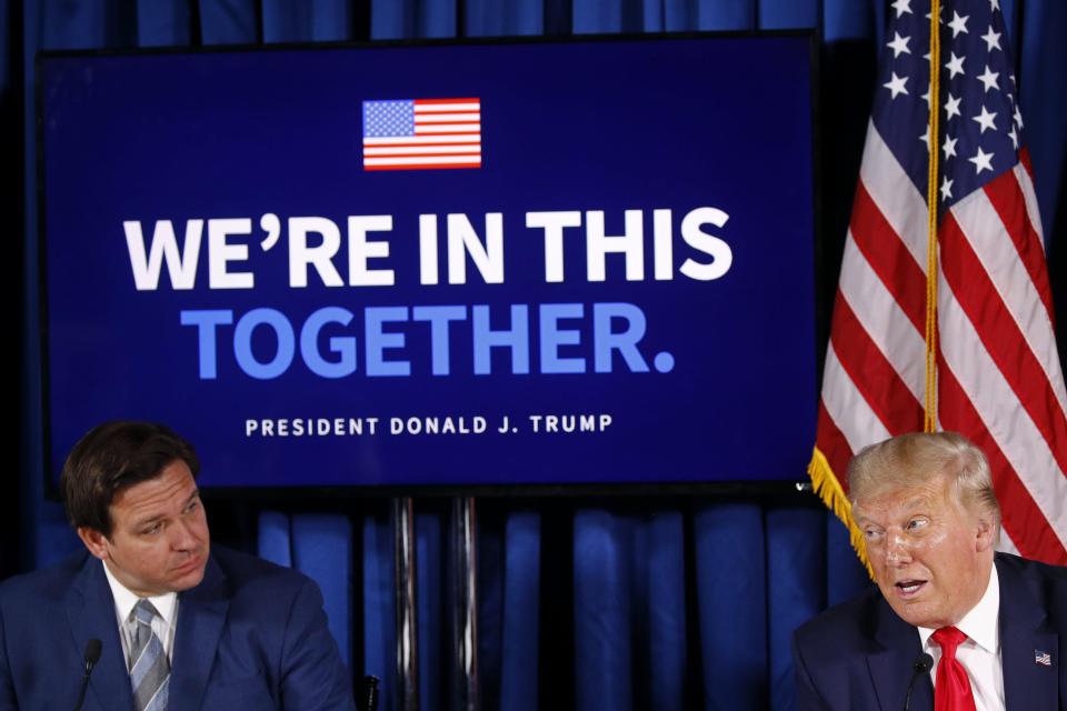 In this 2020 photograph, President Donald Trump speaks as Florida Gov. Ron DeSantis listens during a roundtable discussion on the coronavirus outbreak and storm preparedness. Up until last year, the two frequently appeared in Florida together.