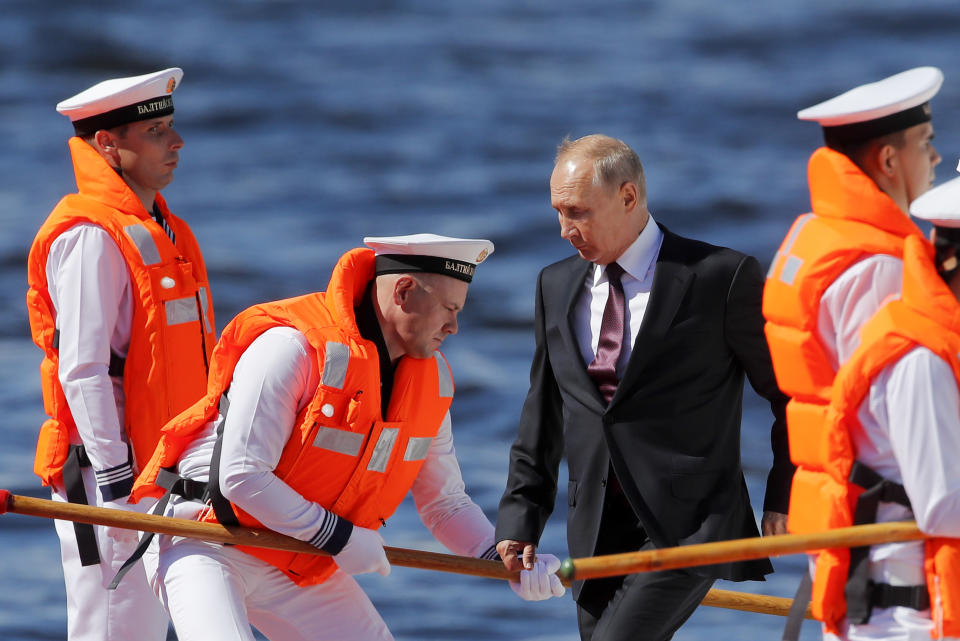 Russian President Vladimir Putin arrives to attend the military parade during the Navy Day celebration in St.Petersburg, Russia, Sunday, July 26, 2020.(AP Photo/Dmitri Lovetsky, Pool)