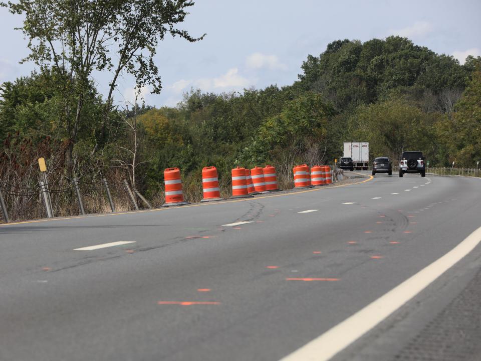 Spray paint and tire skid marks are visible on Interstate 84 in Slate Hill near where a bus lost control and rolled down the median causing 2 fatalities on Thursday. The NTSB will hold a press conference later on Friday Sept. 22, 2023.