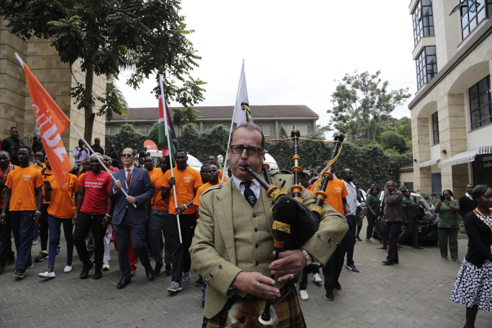 An unidentified man plays the Bagpipes during the reopening of the Dusit D2 hotel in Nairobi, Kenya Wednesday, July 31, 2019. Kenya has reopened the luxury hotel complex after the January deadly attack by Muslim extremists al-Shabab which left twenty-one people dead.(AP Photo/Khalil Senosi)