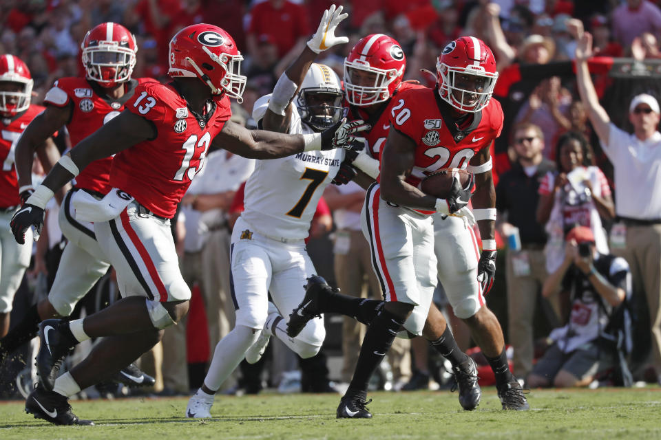 Georgia defensive back J.R. Reed (20) runs for a touchdown after recovering a Murray State fumble in the first half of an NCAA college football game Saturday, Sept. 7, 2019, in Athens, Ga. (AP Photo/John Bazemore)