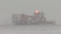 Crews clear runways blanketed with snow Friday at the Halifax Stanfield International Airport.