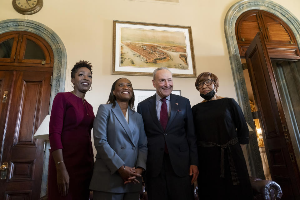 Senate Majority Leader Chuck Schumer, D-N.Y., meets with Laphonza Butler and her family before she is sworn in to succeed the late Sen. Dianne Feinstein, D-Calif., Tuesday, Oct. 3, 2023, on Capitol Hill in Washington. (AP Photo/Stephanie Scarbrough)