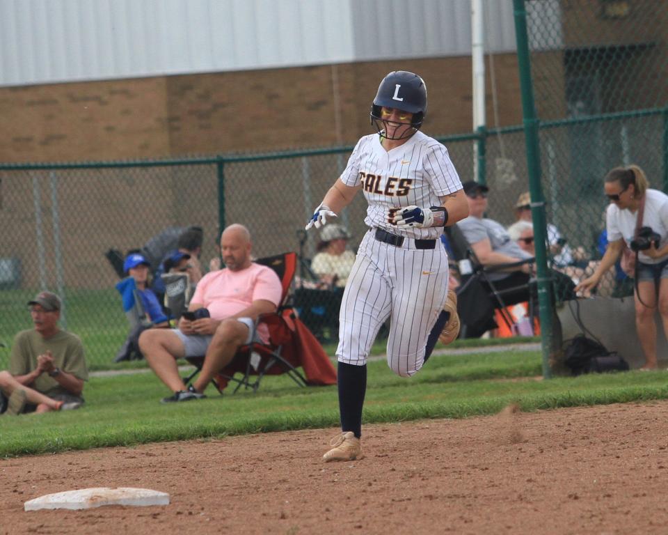Lancaster's Reese Poston celebrates her home run during the Golden Gales' 2-0 victory against Olentangy Liberty in a Division I district final at Pickerington Central on Saturday, May 18, 2024.