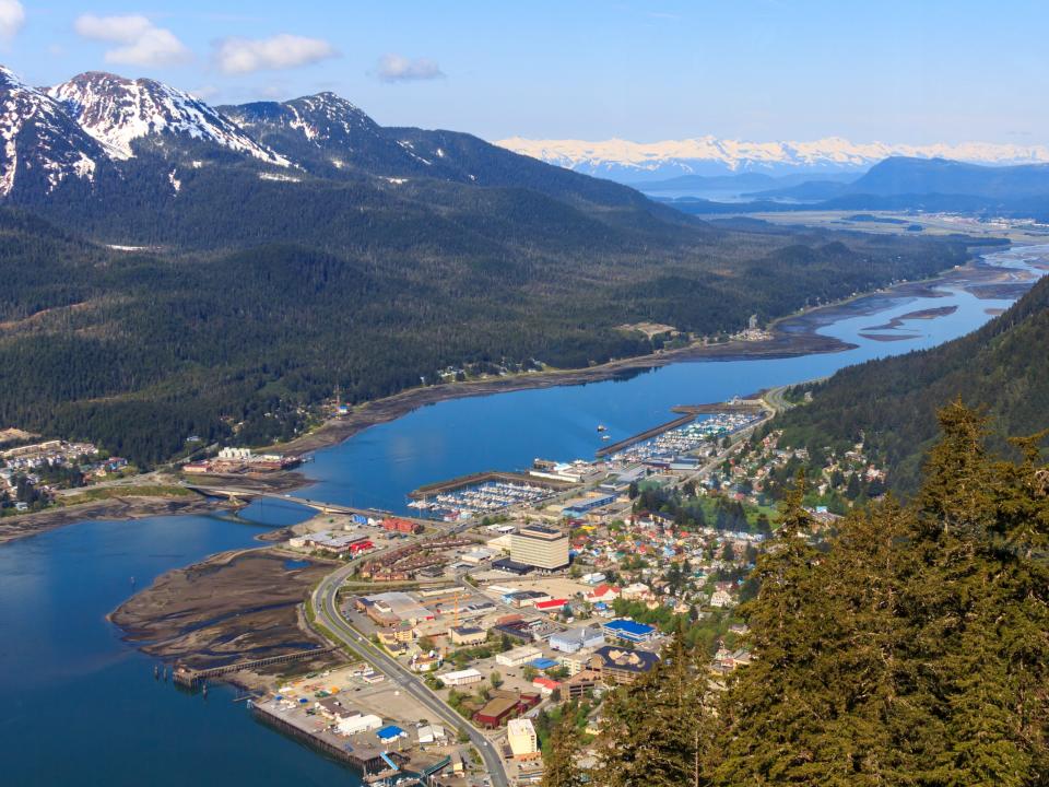 A view of Juneau, Alaska, with mountains and waterways.