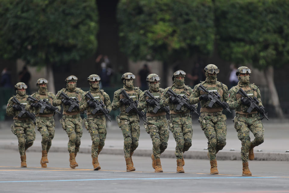 VARIOUS CITIES, MEXICO - SEPTEMBER 16: Marines march during the Independence Day military parade at Zocalo Square on September 16, 2020 in Various Cities, Mexico. This year El Zocalo remains closed for general public due to coronavirus restrictions. Every September 16 Mexico celebrates the beginning of the revolution uprising of 1810. (Photo by Hector Vivas/Getty Images)