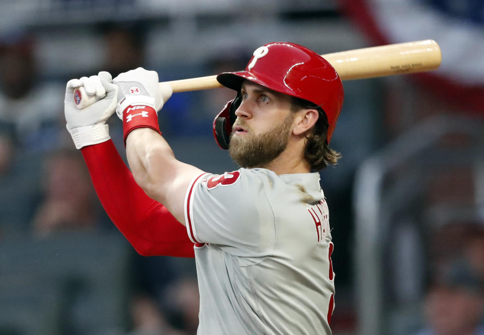 Bryce Harper is first player in MLB history to reach 200 home runs, 1,000 hits on same swing. (AP Photo/John Bazemore)