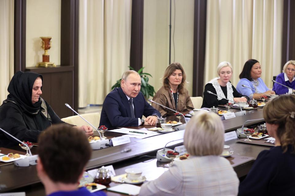 Russian President Vladimir Putin meets with mothers of military personnel serving in the special military operation ahead of Mother's Day at the Novo-Ogaryovo residence outside Moscow, Russia, Friday, Nov. 25, 2022. Mother's Day is celebrated on the last Sunday of November. (Alexander Shcherbak, Sputnik, Kremlin Pool Photo via AP)