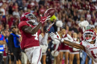Alabama wide receiver Jerry Jeudy (4) catches a touchdown pass against Arkansas during the second half of an NCAA college football game, Saturday, Oct. 26, 2019, in Tuscaloosa, Ala. (AP Photo/Vasha Hunt)