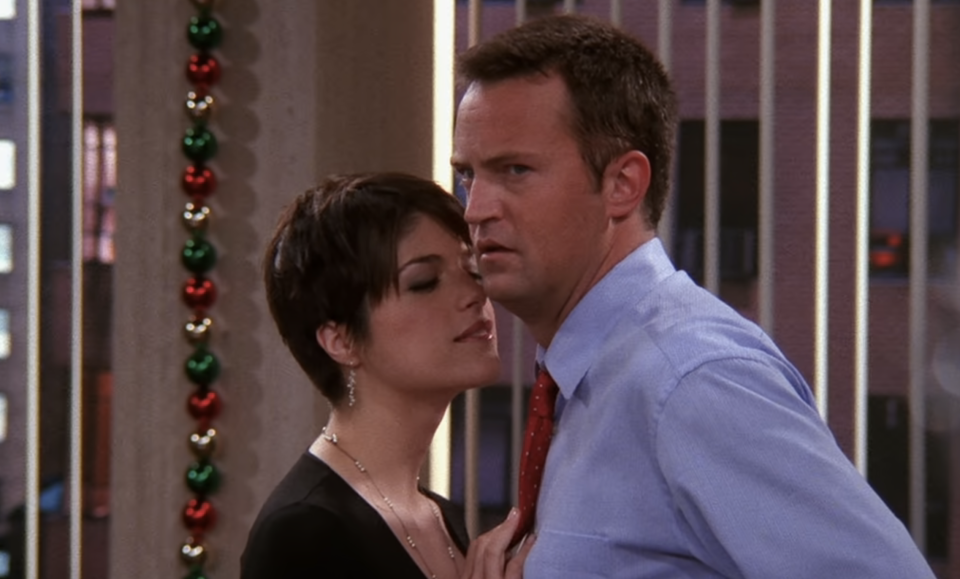 Selma standing close to Matthew in a scene from "Friends"