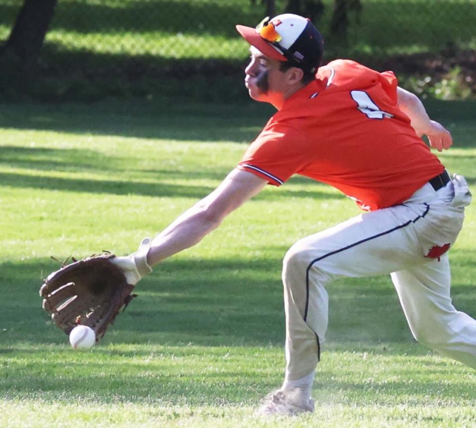 Stoughton center fielder Jo McNulty attempts to make a catch  during a game versus Oliver Ames on Monday, May 16, 2022.    