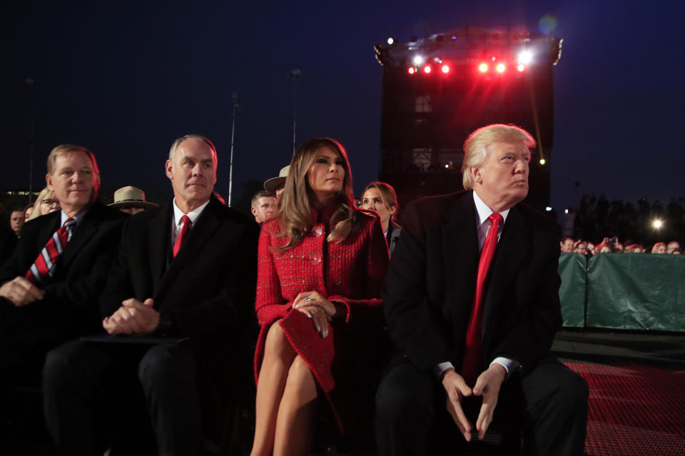 <p>President Donald Trump and first lady Melania Trump, watch performances during the National Christmas Tree lighting ceremony at the Ellipse near the White House in Washington, Thursday, Nov. 30, 2017, with Interior Secretary Ryan Zinke, second from left. (Photo: Manuel Balce Ceneta/AP) </p>