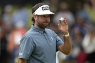 Bubba Watson waves after making a putt on the seventh hole during the final round of the PGA Championship golf tournament at Southern Hills Country Club, Sunday, May 22, 2022, in Tulsa, Okla. (AP Photo/Eric Gay)