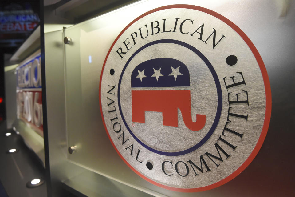 FILE - The Republican National Committee logo is shown on the stage as crew members work at the North Charleston Coliseum, Jan. 13, 2016, in North Charleston, S.C. The first 2024 Republican presidential debate is on Wednesday, Aug. 23, 2023, at Fiserv Forum in Milwaukee. (AP Photo/Rainier Ehrhardt, File)