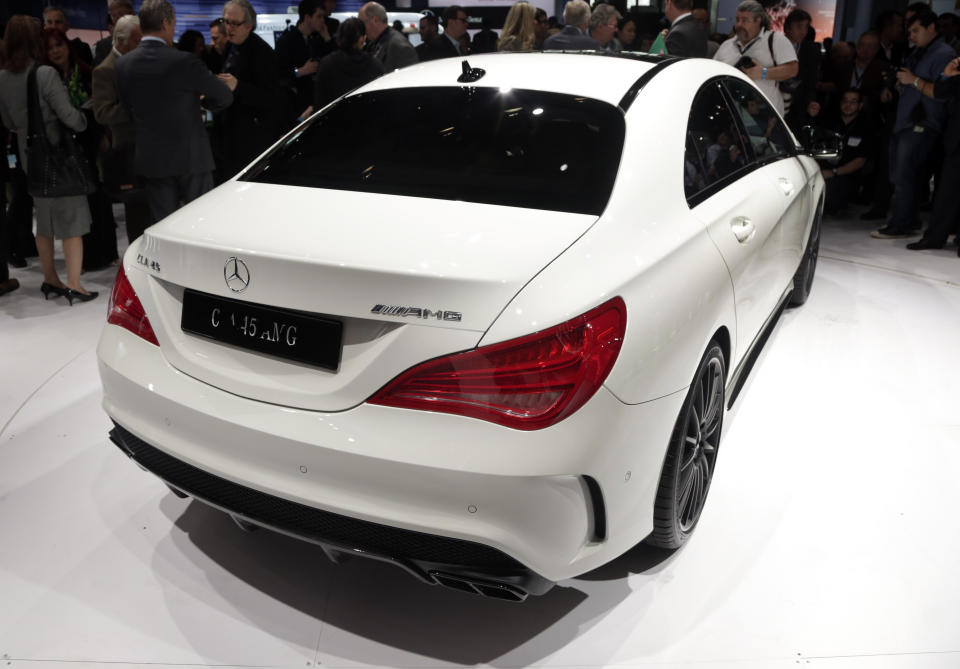 FILE - In this March 27, 2013 file photo, the 2014 CLA 45 AMG Mercedes-Benz is presented at the New York International Auto Show, in the Javits Center, in New York. The CLA 45 AMG all-wheel-drive with 355 horses goes on sale in November. (AP Photo/Richard Drew, File)