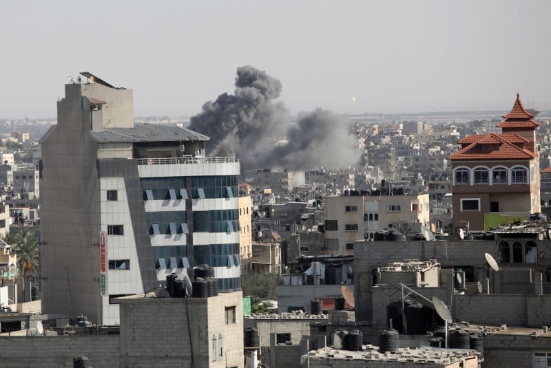 Smoke and dust rise after an Israeli air strike in Rafah, in the southern Gaza Strip on Monday. Photo by Ismael Mohamad/UPI