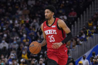 Houston Rockets center Christian Wood brings the ball up against the Golden State Warriors during the first half of an NBA basketball game in San Francisco, Friday, Jan. 21, 2022. (AP Photo/Jeff Chiu)