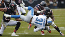 Detroit Lions running back Ty Johnson (31) is brought down by Chicago Bears cornerback Kyle Fuller (23), linebacker Danny Trevathan (59) and Leonard Floyd (94) during the first half of an NFL football game in Chicago, Sunday, Nov. 10, 2019. (AP Photo/Charles Rex Arbogast)