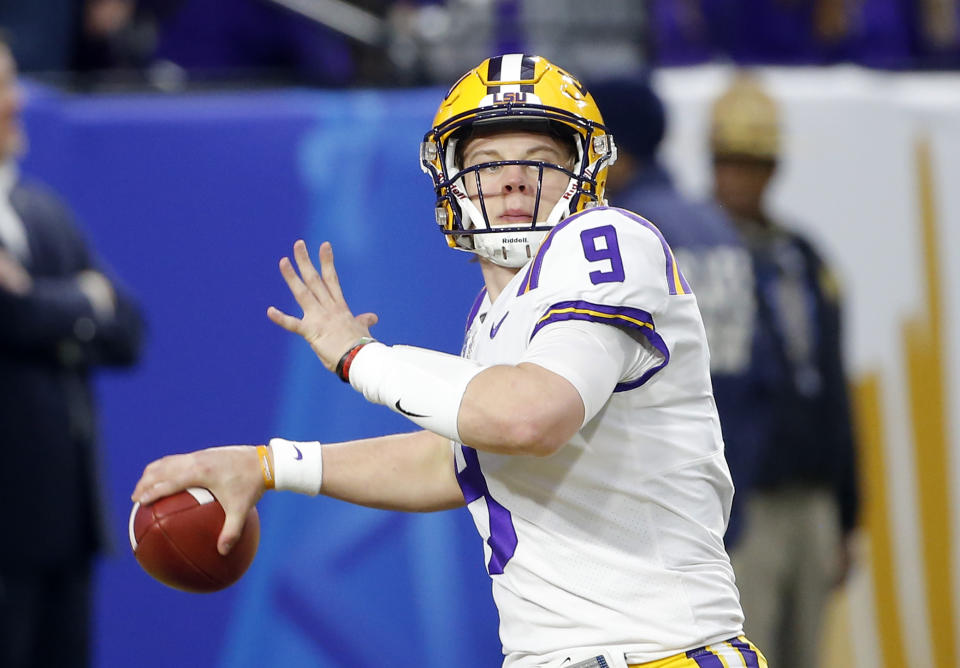 LSU quarterback Joe Burrow (9) warms up before the Fiesta Bowl NCAA college football game against UCF, Tuesday, Jan. 1, 2019, in Glendale, Ariz. (AP Photo/Rick Scuteri)