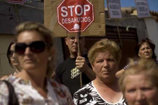 People protest in Chiclana, near Cadiz against mortgage foreclosures. Prime Minister Mariano Rajoy's conservative government this month instructed Spain's banks to set aside an extra 30 billion euros in 2012 in case property-related loans go bad