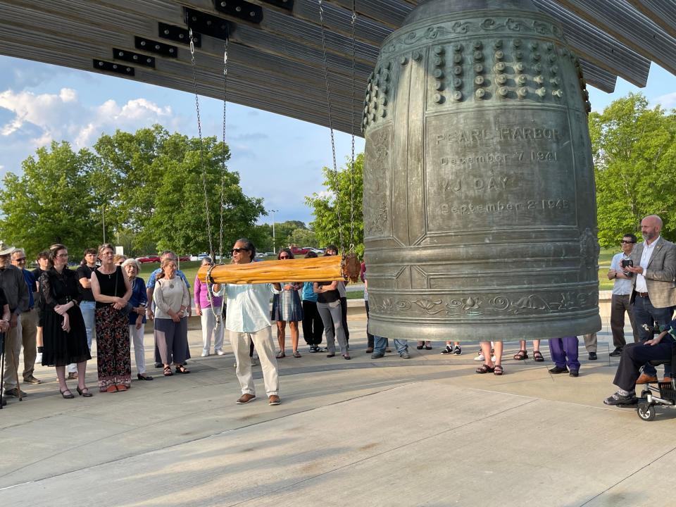 Ram Uppuluri Jr., prepares to ring the International Friendship Bell his mother helped to get designed in Oak Ridge, cast in Japan and delivered to Oak Ridge.
