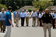 <p>President Barack Obama (center R) tours a flood-affected neighborhood with U.S. Senator David Vitter (R-LA) (center group, from L), Louisiana Governor John Bel Edwards and U.S. Senator Bill Cassidy (R-LA) in Zachary, La., Aug. 23, 2016. (Photo: Jonathan Ernst/Reuters) </p>