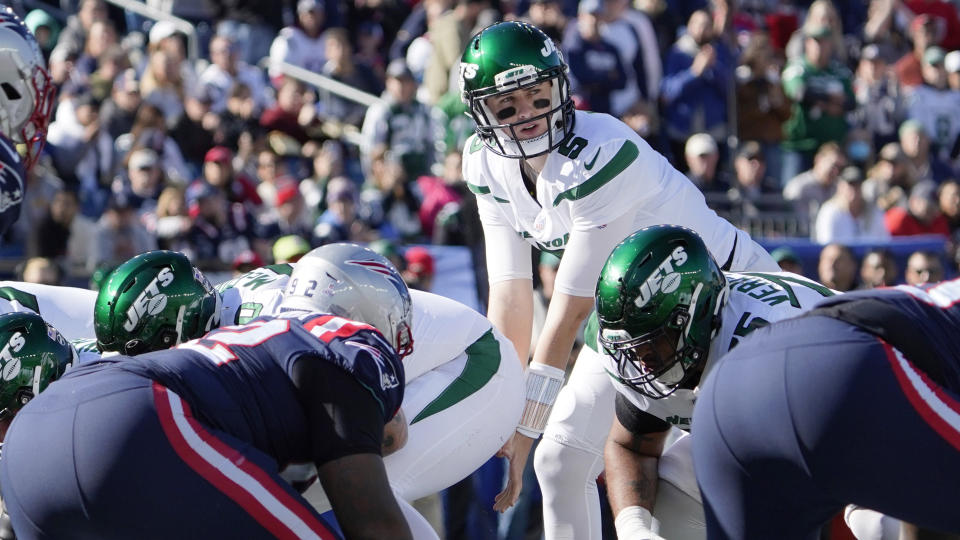 New York Jets quarterback Mike White (5) on the line of scrimmage, after replacing Jack Wilson, during the first half of an NFL football game against the New England Patriots, Sunday, Oct. 24, 2021, in Foxborough, Mass. (AP Photo/Mary Schwalm)