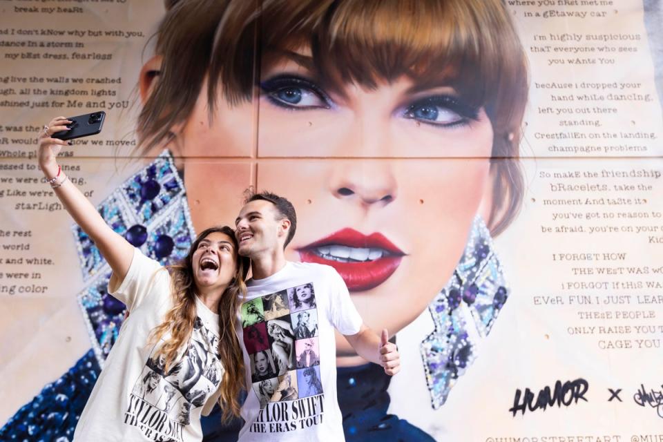 Italian fans Giorgia Zampetti (left) and Tommaso Zampetti in front a new mural being unveiled at Wembley Park (David Parry/PA Media Assignments)