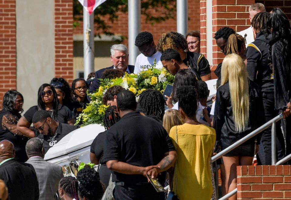The casket carrying Dadeville shooting victim Phil Dowdell is carried from his funeral at Dadeville High School in Dadeville, Ala., on Monday April 24, 2023. 
