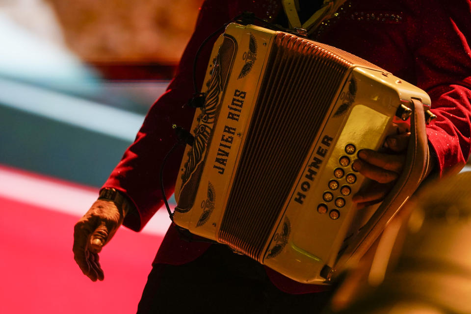 FILE - Invasores de Nuevo León accordionist Javier Ríos performs during the Arre Music Festival, which features Mexican regional musicians, in Mexico City, Sept. 8, 2024. (AP Photo/Felix Marquez, File)