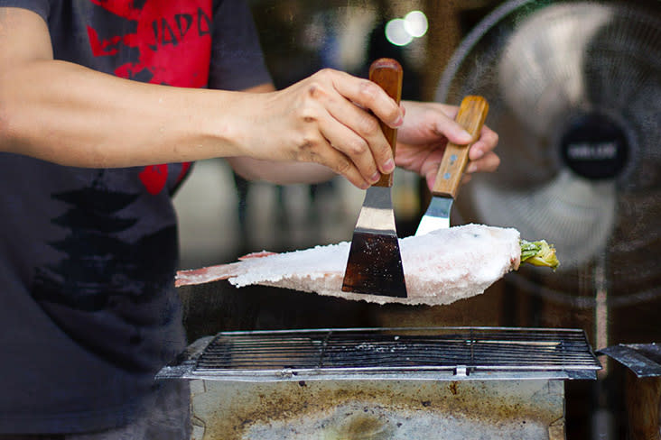 The crackle of salt-encrusted fish on a hot grill.