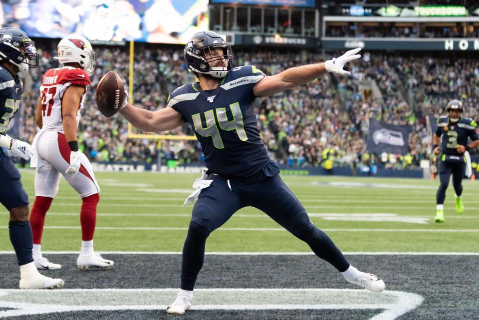 Dec 22, 2019; Seattle, Washington, USA; Seattle Seahawks running back Nick Bellore (44) spikes the ball after scoring a touchdown against the Arizona Cardinals during the first half at CenturyLink Field. Mandatory Credit: Steven Bisig-USA TODAY Sports