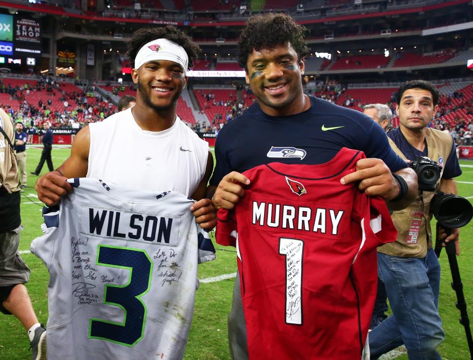 Arizona Cardinals quarterback Kyler Murray (left) and Seattle quarterback Russell Wilson (right) swap jerseys after the Seahawks won 27-10 during a game on Sep. 29, 2019, in Glendale, Ariz.