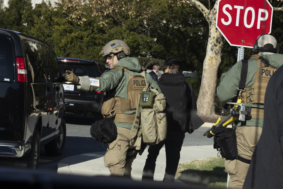 Members of the U.S. Secret Service' Hazardous Agent Mitigation and Medical Emergency Response (HAMMER) Team, move from their vehicle as President Donald Trump is visiting Walter Reed National Military Medical Center, Saturday, Nov. 16, 2019, in Bethesda, Md. (AP Photo/Manuel Balce Ceneta)