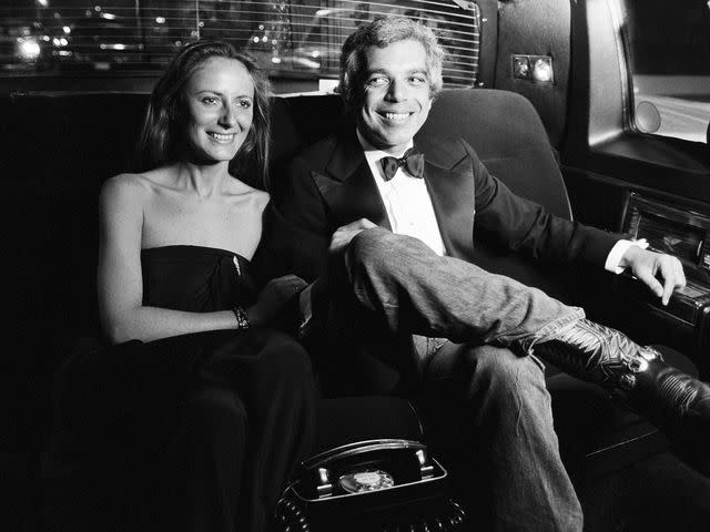 <p>Susan Wood/Getty</p> Ralph Lauren and his wife, therapist Ricky Lauren, smile in the backseat of a limo in New York in November 1977