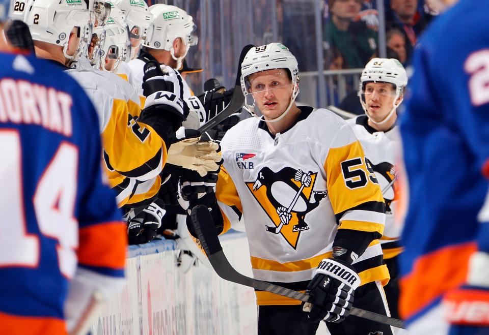 ELMONT, NEW YORK - DECEMBER 27: Jake Guentzel #59 of the Pittsburgh Penguins celebrates one of his second period goals against the New York Islanders at UBS Arena on December 27, 2023 in Elmont, New York. (Photo by Bruce Bennett/Getty Images) ORG XMIT: 776033746 ORIG FILE ID: 1888525922